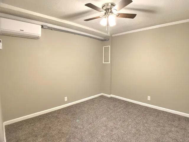 en empty room with a fan