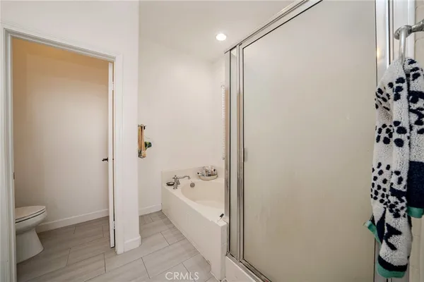 a bathroom with a bathtub and shower