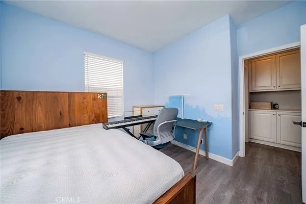 a bedroom with bed and a window