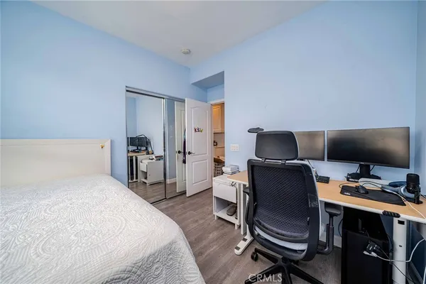 a bedroom with a workspace