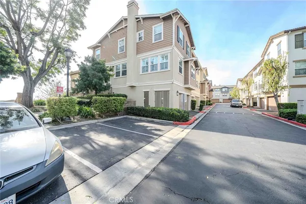 a view of a white apartments with large windows