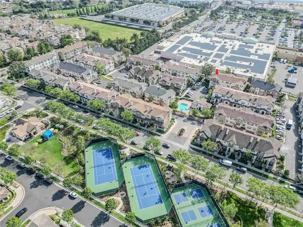an aerial view of residential houses with outdoor space