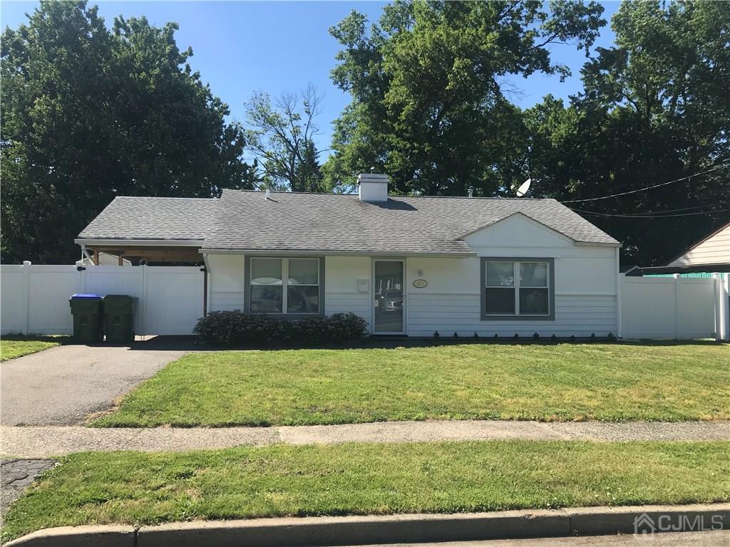 42 Kenmore Road Edison, NJ 08817 - Photo 1 of 14 a front view of a house with a yard