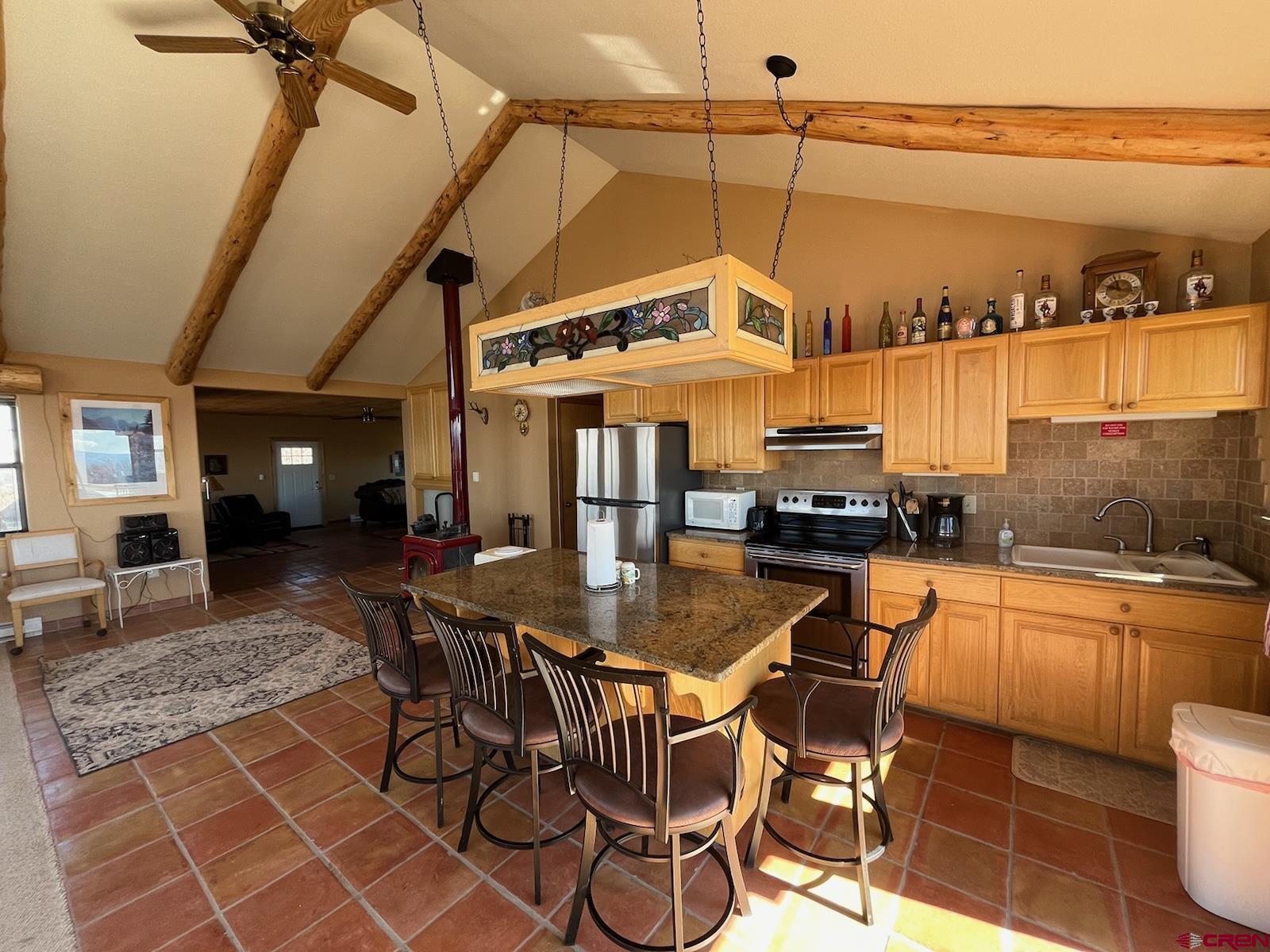 a view of a patio with table and chairs with wooden floor