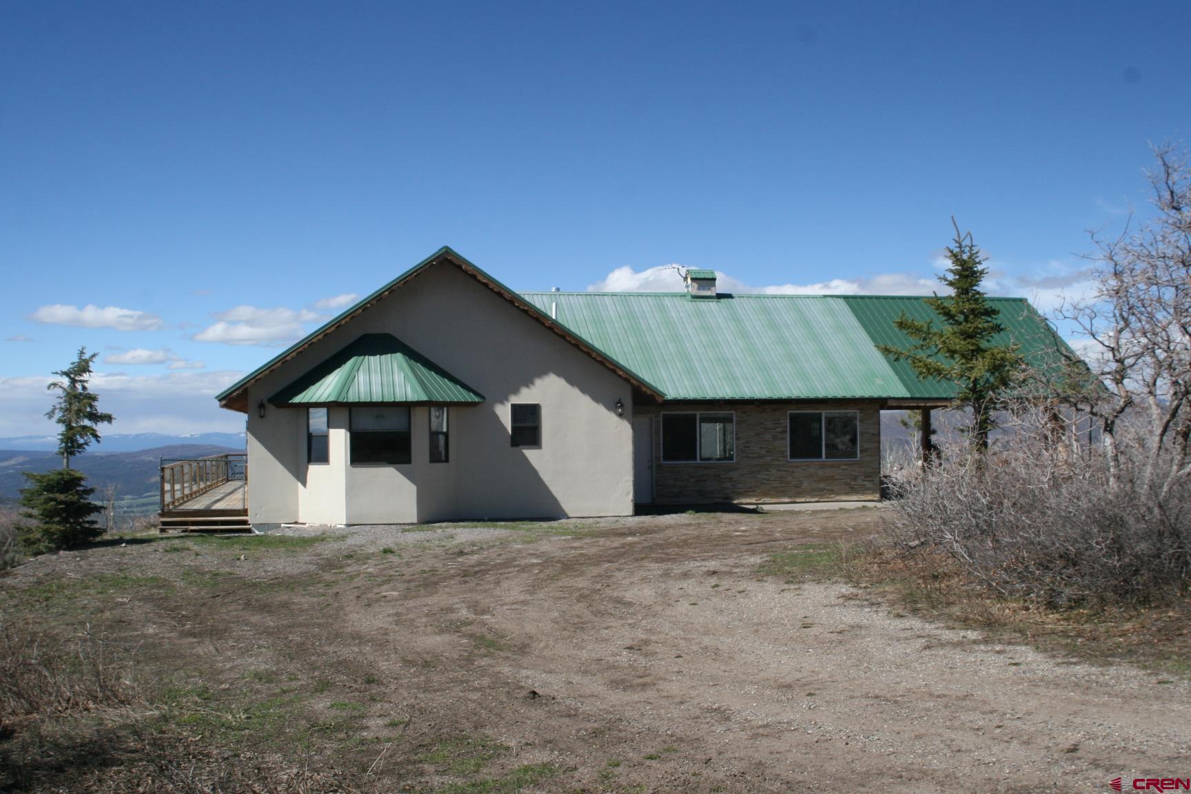 75160 Q72 Road Montrose, CO 81401 - Photo 21 of 33 a house with trees in the background