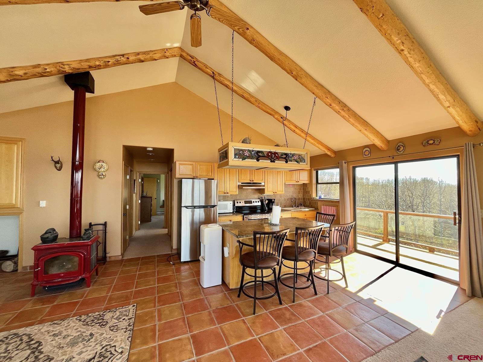 75160 Q72 Road Montrose, CO 81401 - Photo 27 of 33 a view of a patio with dining table and chairs