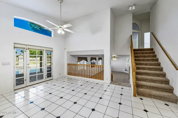 a kitchen with a sink appliances and cabinets