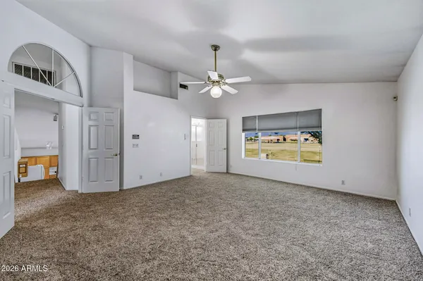 a view of an empty room with a window