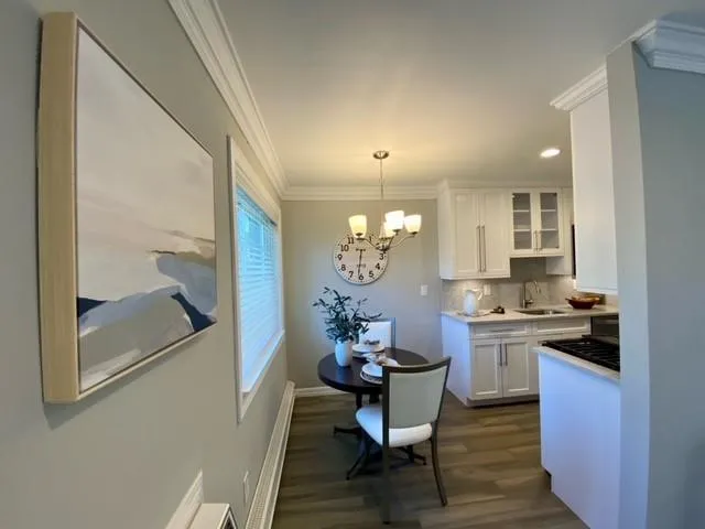 a kitchen with a table and chairs in it