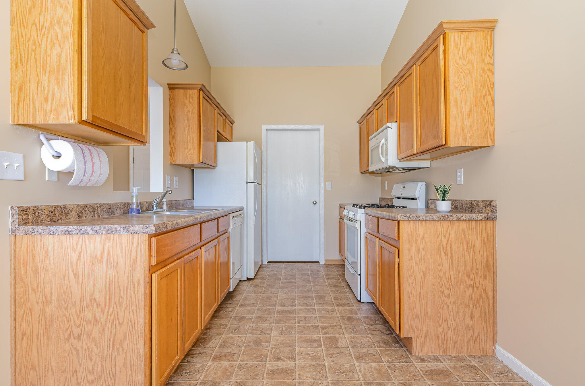 370 South Boo Road Burns Harbor, IN 46304 - Photo 7 of 22 a large kitchen with stainless steel appliances granite countertop a sink and a cabinets