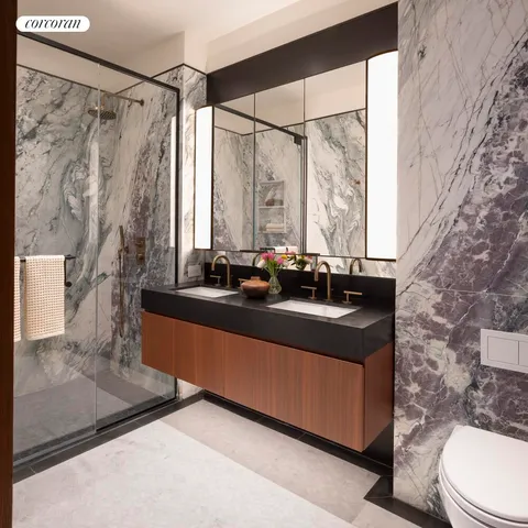 a bathroom with a sink a toilet and a mirror