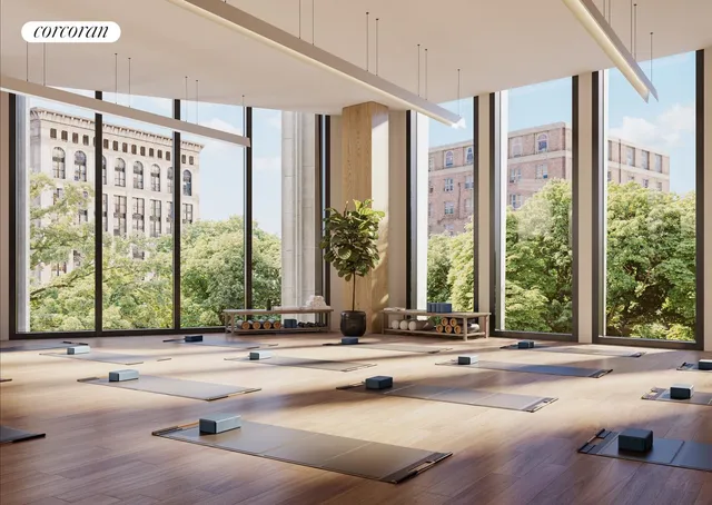 a view of a living room and floor to ceiling windows