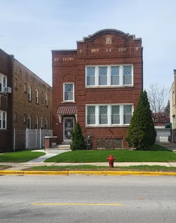 a view of a building with a yard