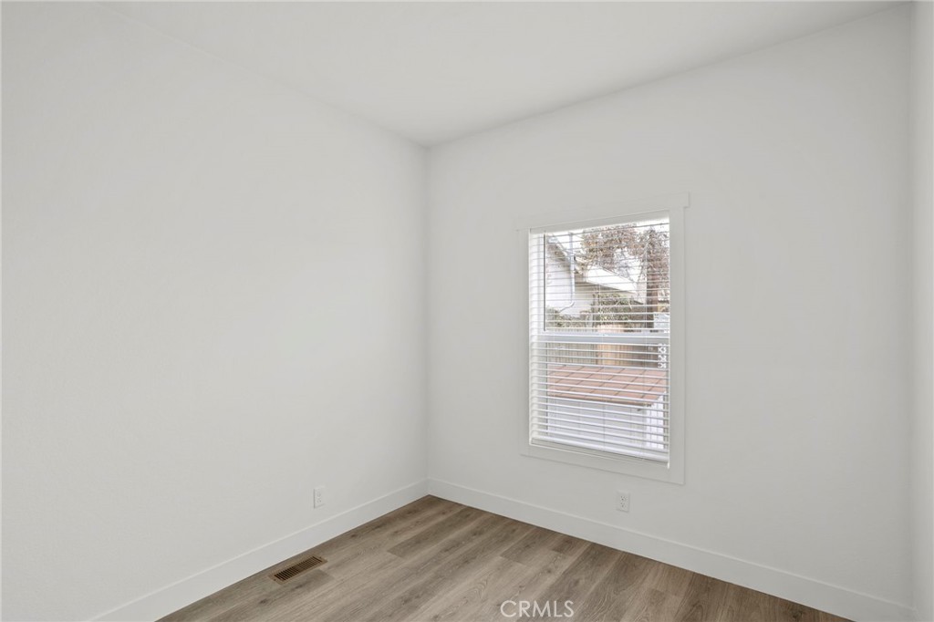 2548 Peck Road, Unit 39 Monrovia, CA 91016 - Photo 15 of 26 a view of an empty room with wooden floor and a window