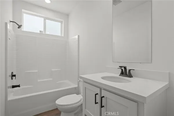 a bathroom with a sink a toilet and a bathtub