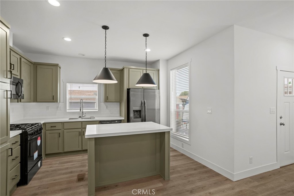 2548 Peck Road, Unit 39 Monrovia, CA 91016 - Photo 6 of 26 a kitchen with a sink a counter top space stainless steel appliances and cabinets