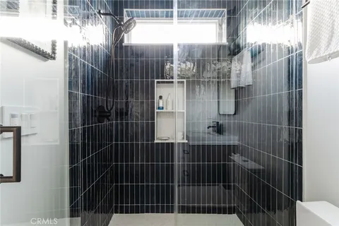 a bed room with furniture and a large window