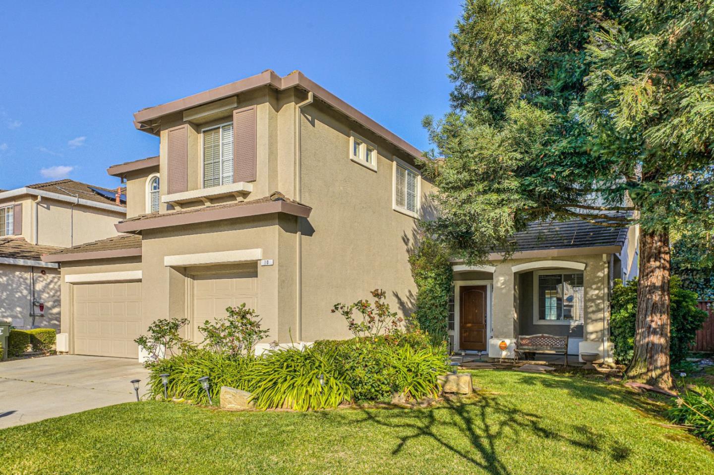 a front view of a house with garden