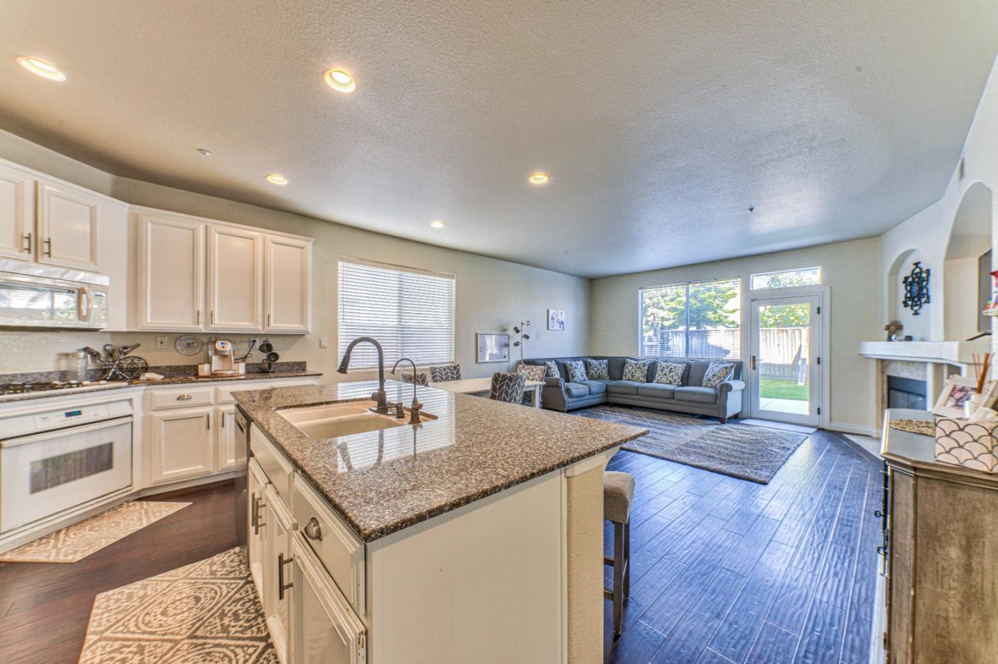 10 Whitman Circle Salinas, CA 93906 - Photo 18 of 33 a open kitchen with stainless steel appliances granite countertop a lot of counter space and wooden floors