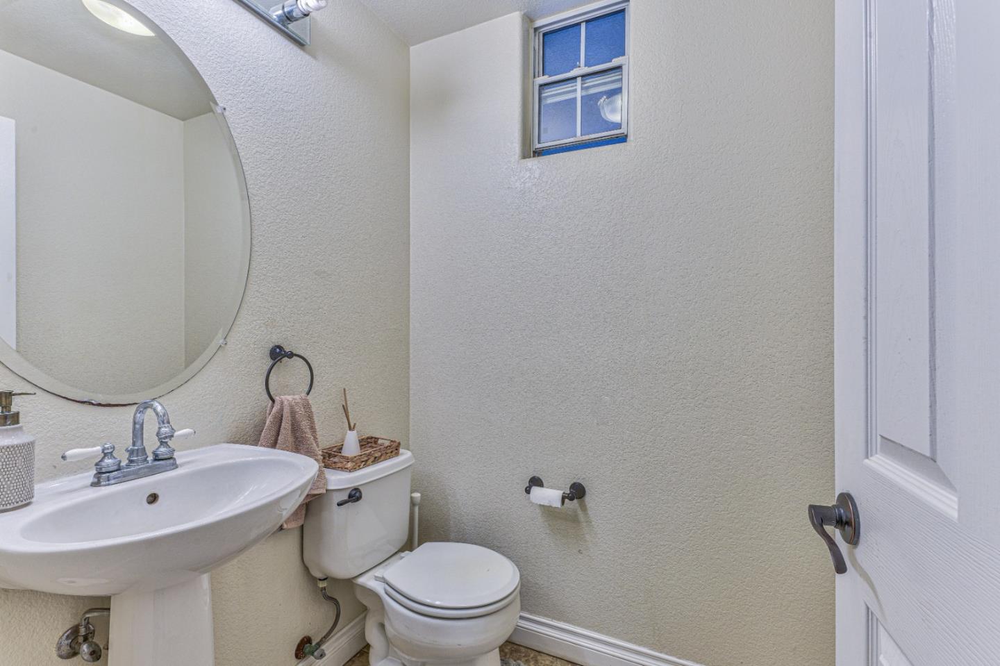 10 Whitman Circle Salinas, CA 93906 - Photo 20 of 33 a bathroom with a toilet a sink and mirror
