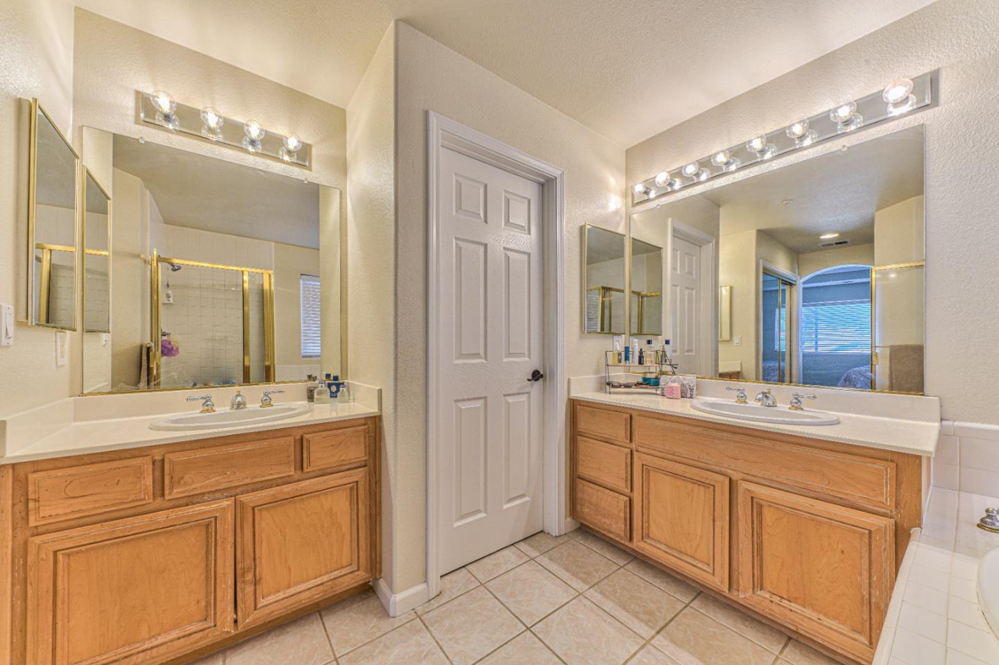 10 Whitman Circle Salinas, CA 93906 - Photo 25 of 33 a bathroom with a sink vanity and mirror