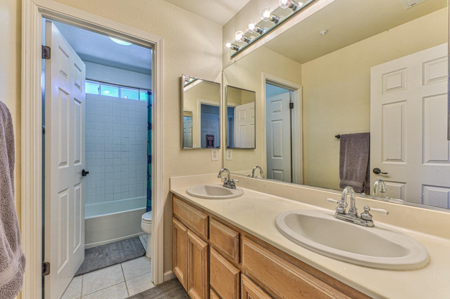 10 Whitman Circle Salinas, CA 93906 - Photo 33 of 33 a bathroom with a double vanity sink and a mirror