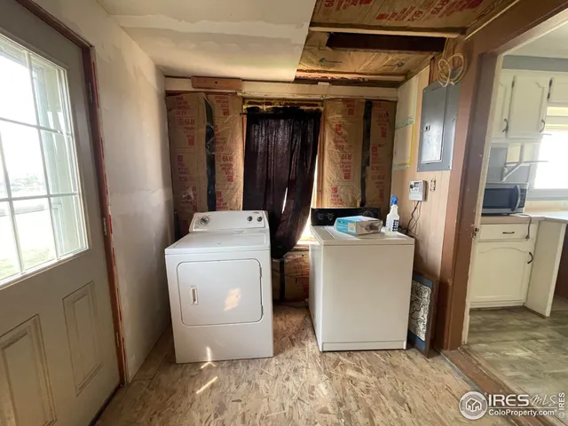 a view of a hallway with wooden shelves