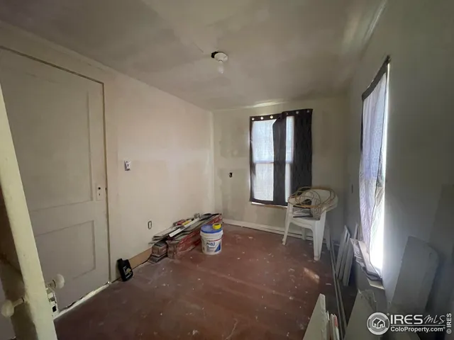 a kitchen with stainless steel appliances a stove top oven a sink and a refrigerator