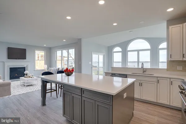 a kitchen with a stove a refrigerator and a dining table