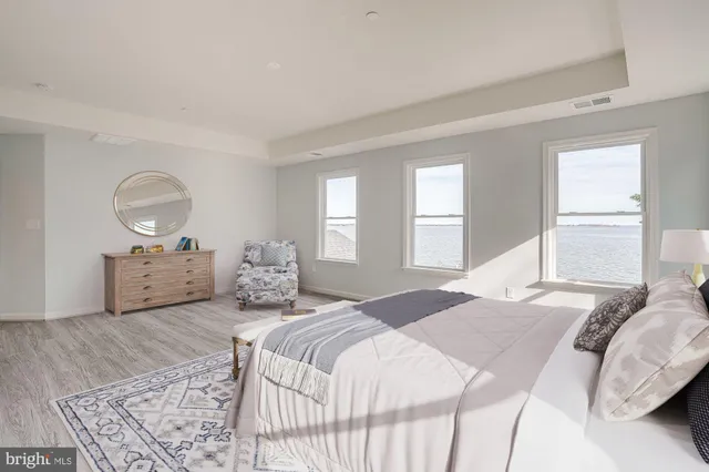 a bathroom with double sink and a mirror