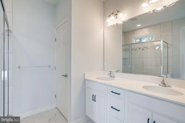 a bathroom with a bathtub and window