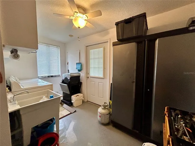 a room with gym equipment and a window