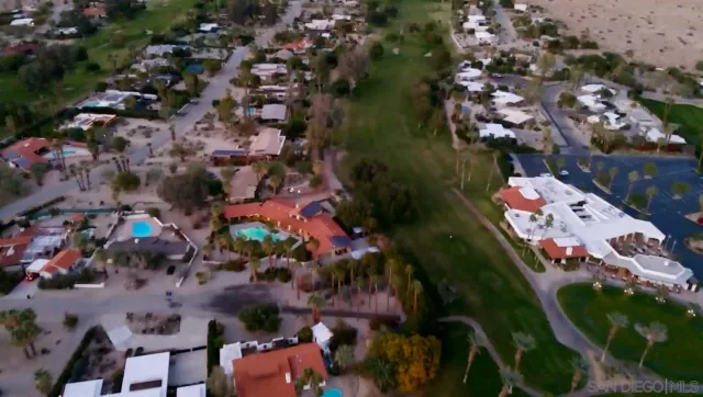 an aerial view of a house with a lake view