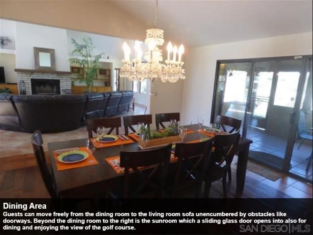 438 De Anza Spur Road Borrego Springs, CA 92004 - Photo 27 of 74 a living room with furniture a chandelier and a dining table