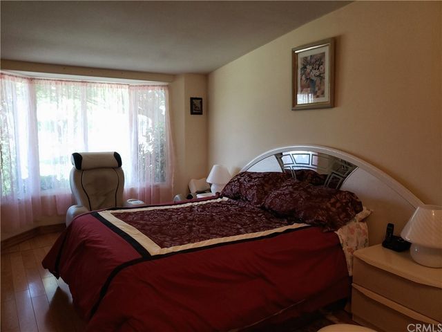 a bed room with a bed and a mirror