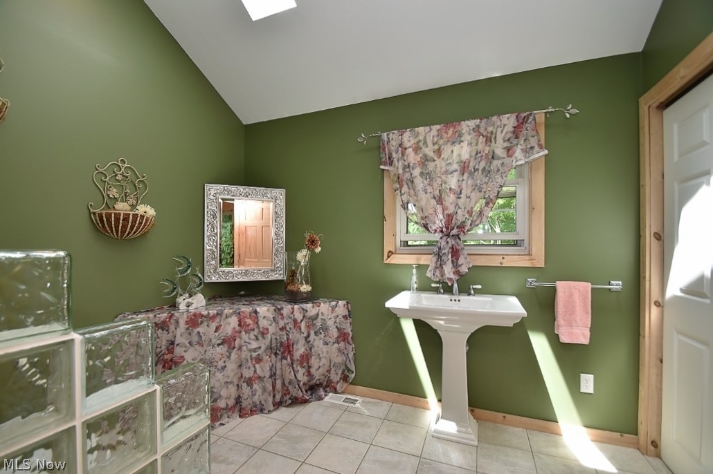 13187 County Line Road Chesterland, OH 44026 - Photo 9 of 35 Half bath off of the Sun Room, plenty of extra storage or room for full bath.