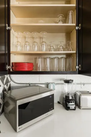 a bedroom with a bed and a desk