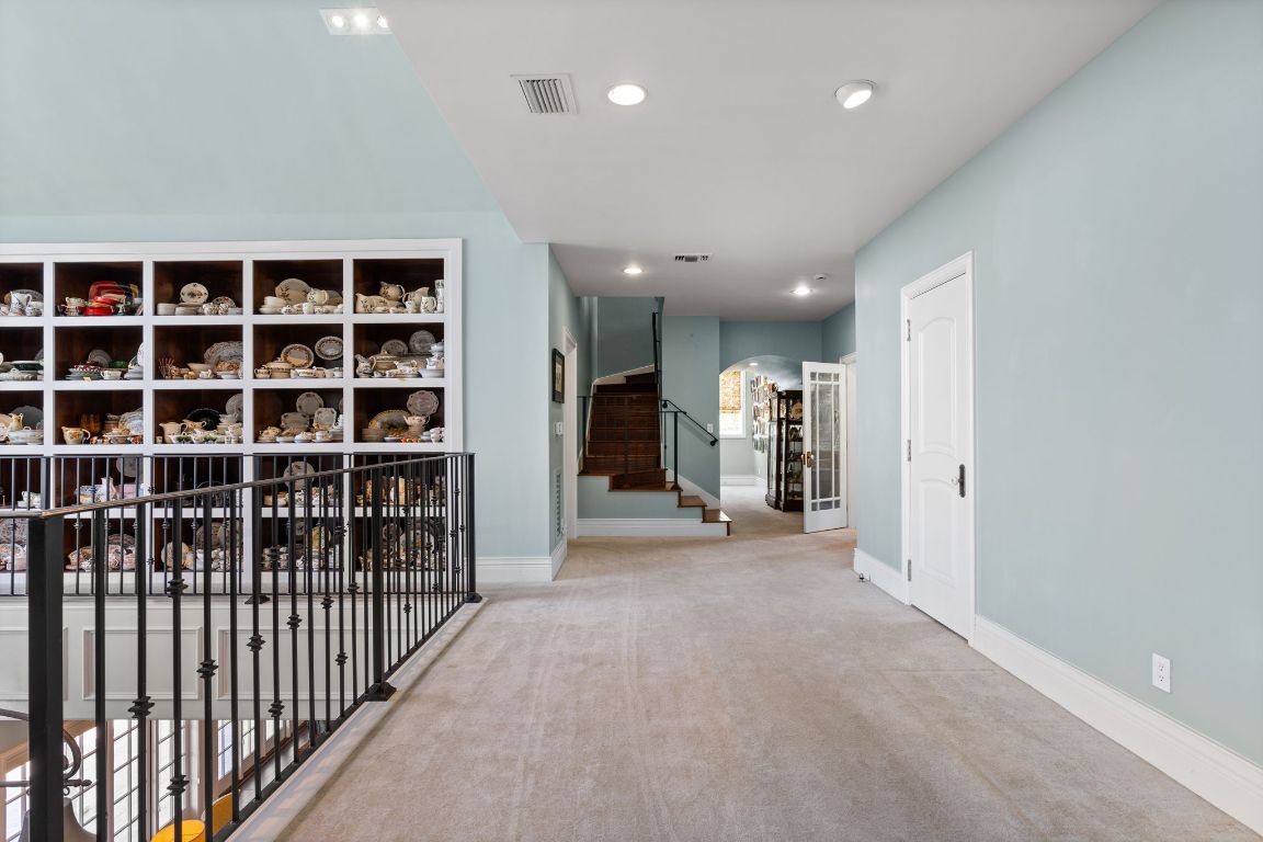 999 Schwarzlose Road New Braunfels, TX 78130 - Photo 14 of 39 a view of a hallway with wooden stairs