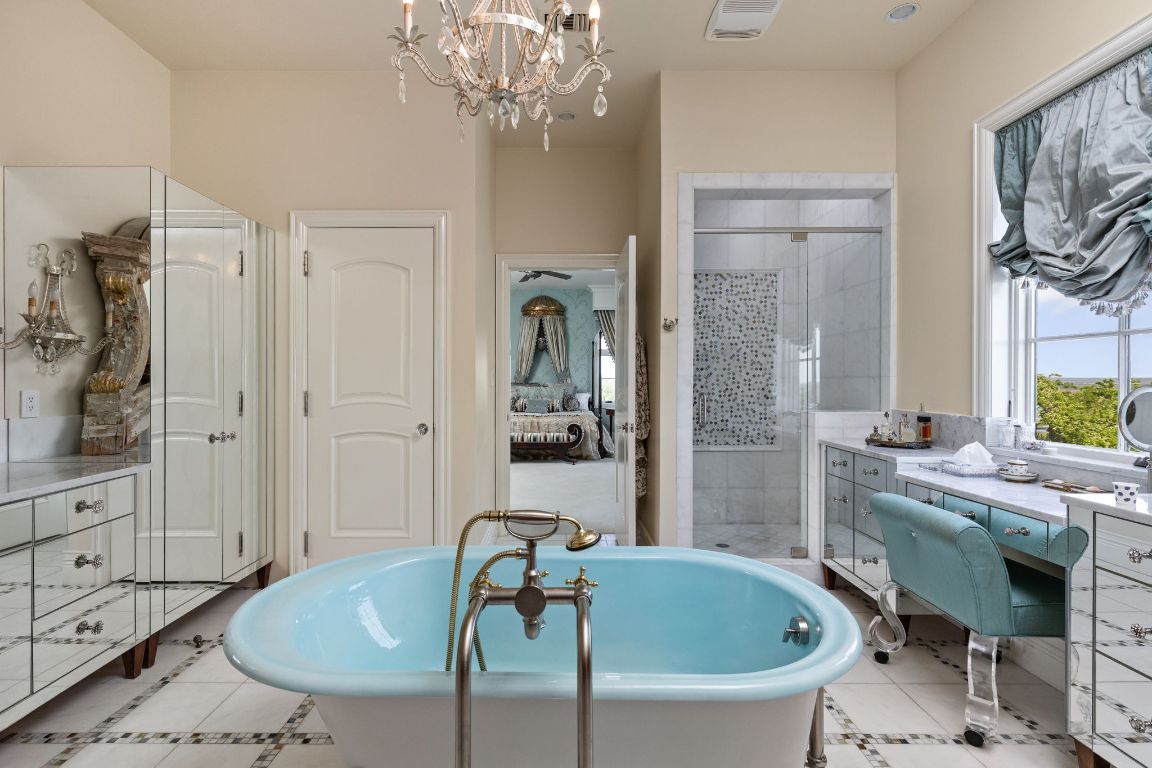 999 Schwarzlose Road New Braunfels, TX 78130 - Photo 18 of 39 a bathroom with a tub sink and mirror