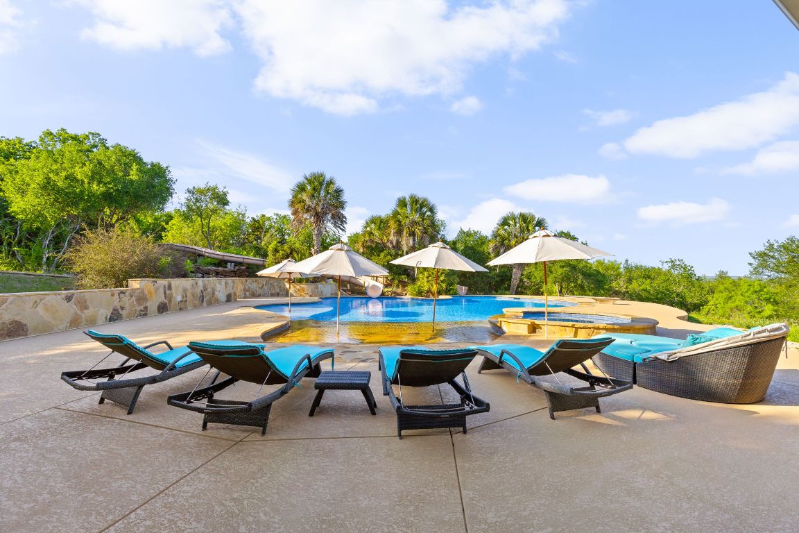 999 Schwarzlose Road New Braunfels, TX 78130 - Photo 30 of 39 a view of outdoor space with swimming pool and lounge chairs