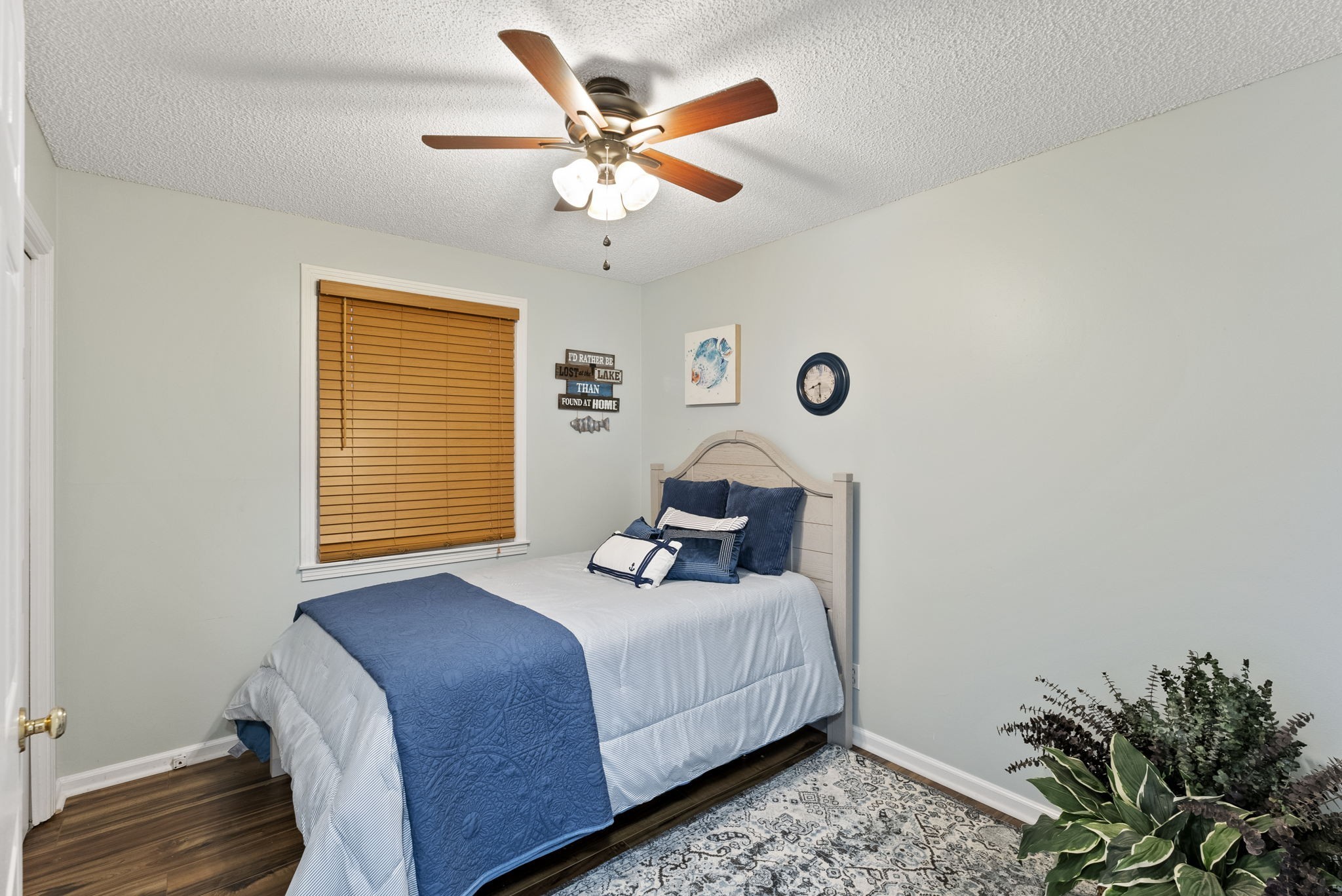 812 Burton Point Road Mount Juliet, TN 37122 - Photo 15 of 59 a bedroom with a bed and a ceiling fan