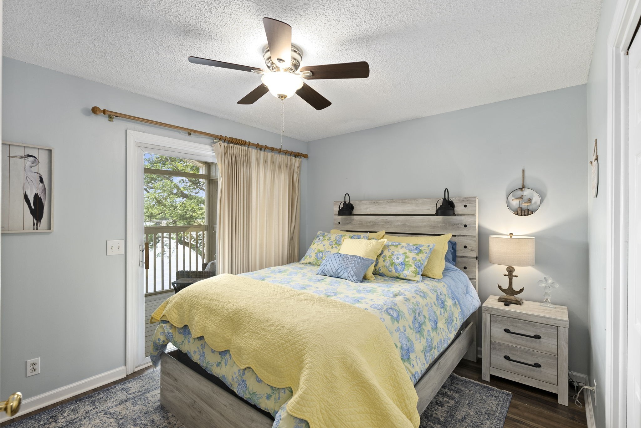 812 Burton Point Road Mount Juliet, TN 37122 - Photo 17 of 59 a bedroom with a bed and a chandelier