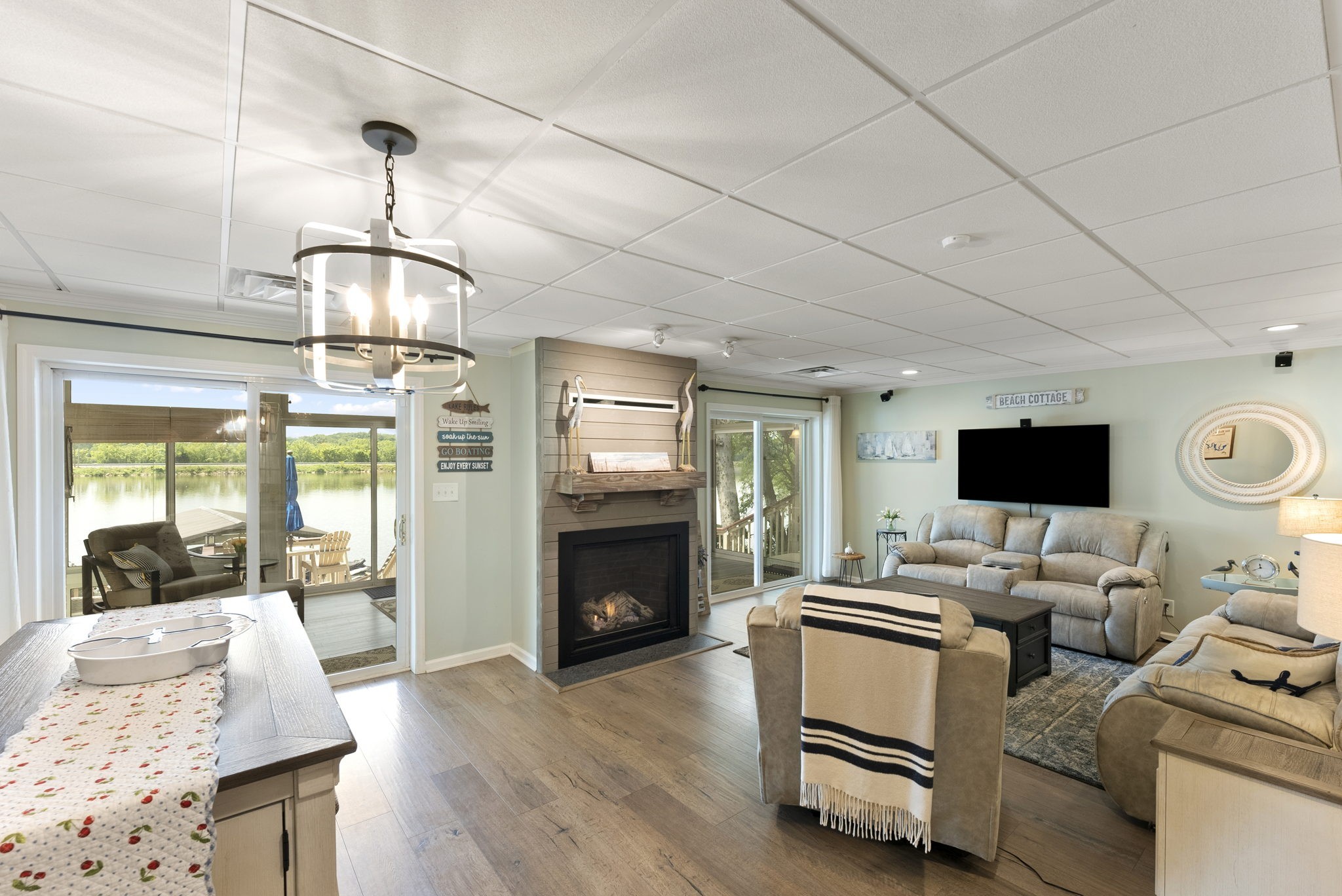812 Burton Point Road Mount Juliet, TN 37122 - Photo 23 of 59 a living room with furniture a fireplace and a flat screen tv