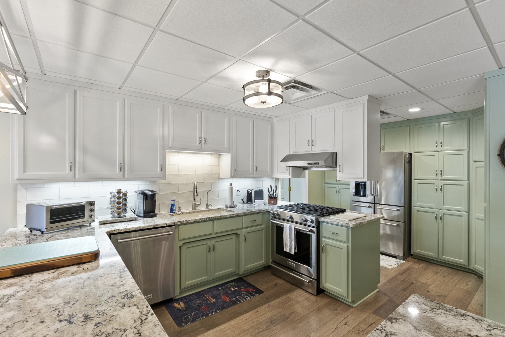 812 Burton Point Road Mount Juliet, TN 37122 - Photo 27 of 59 a kitchen with a stove a sink and a refrigerator