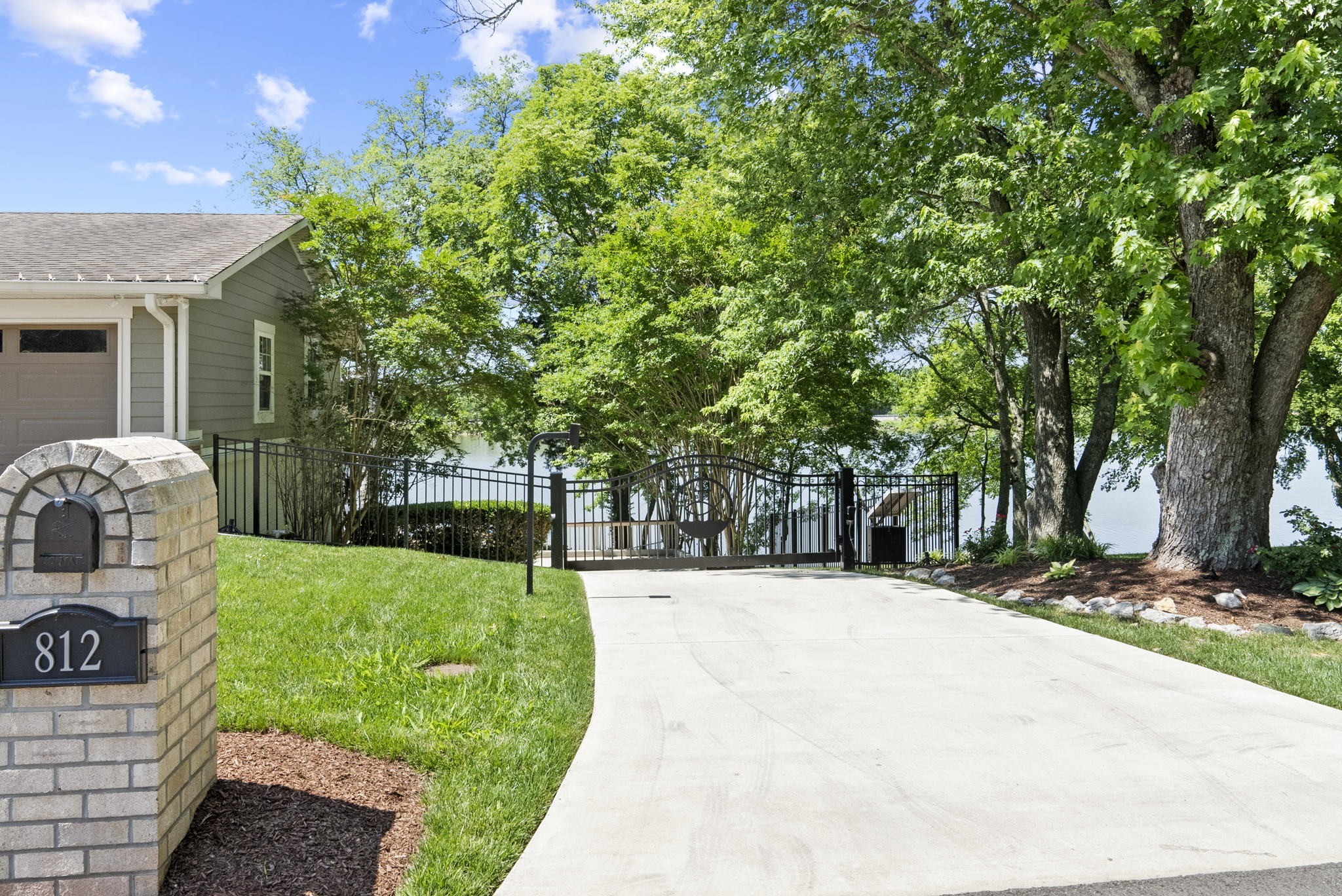 812 Burton Point Road Mount Juliet, TN 37122 - Photo 3 of 59 a view of a backyard with table and chairs and potted plants