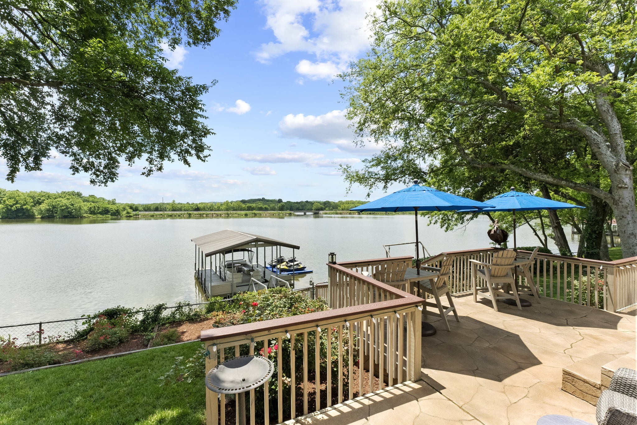 812 Burton Point Road Mount Juliet, TN 37122 - Photo 37 of 59 a view of a deck with two chair and a table