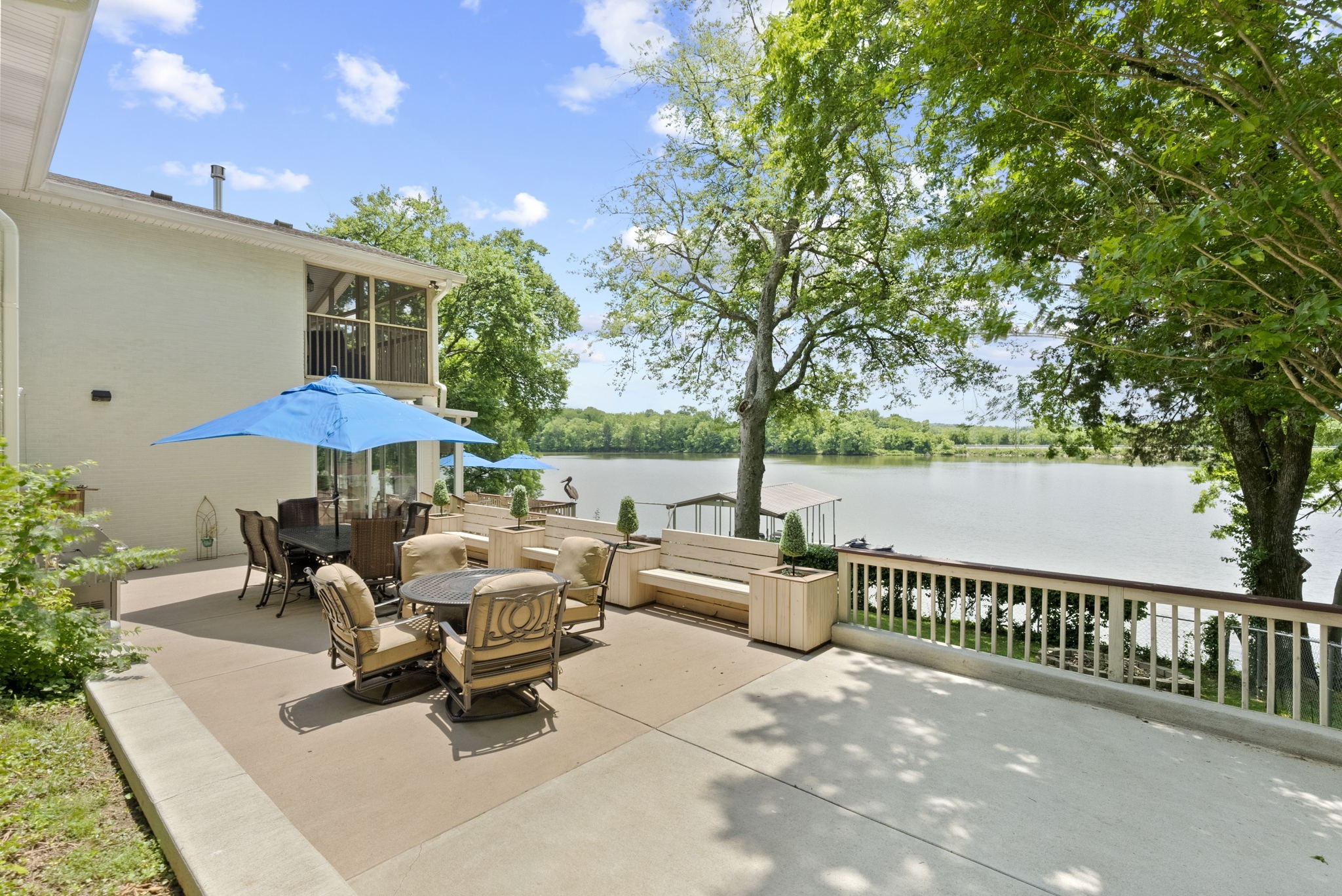 812 Burton Point Road Mount Juliet, TN 37122 - Photo 38 of 59 a view of a tables and chairs under an umbrella
