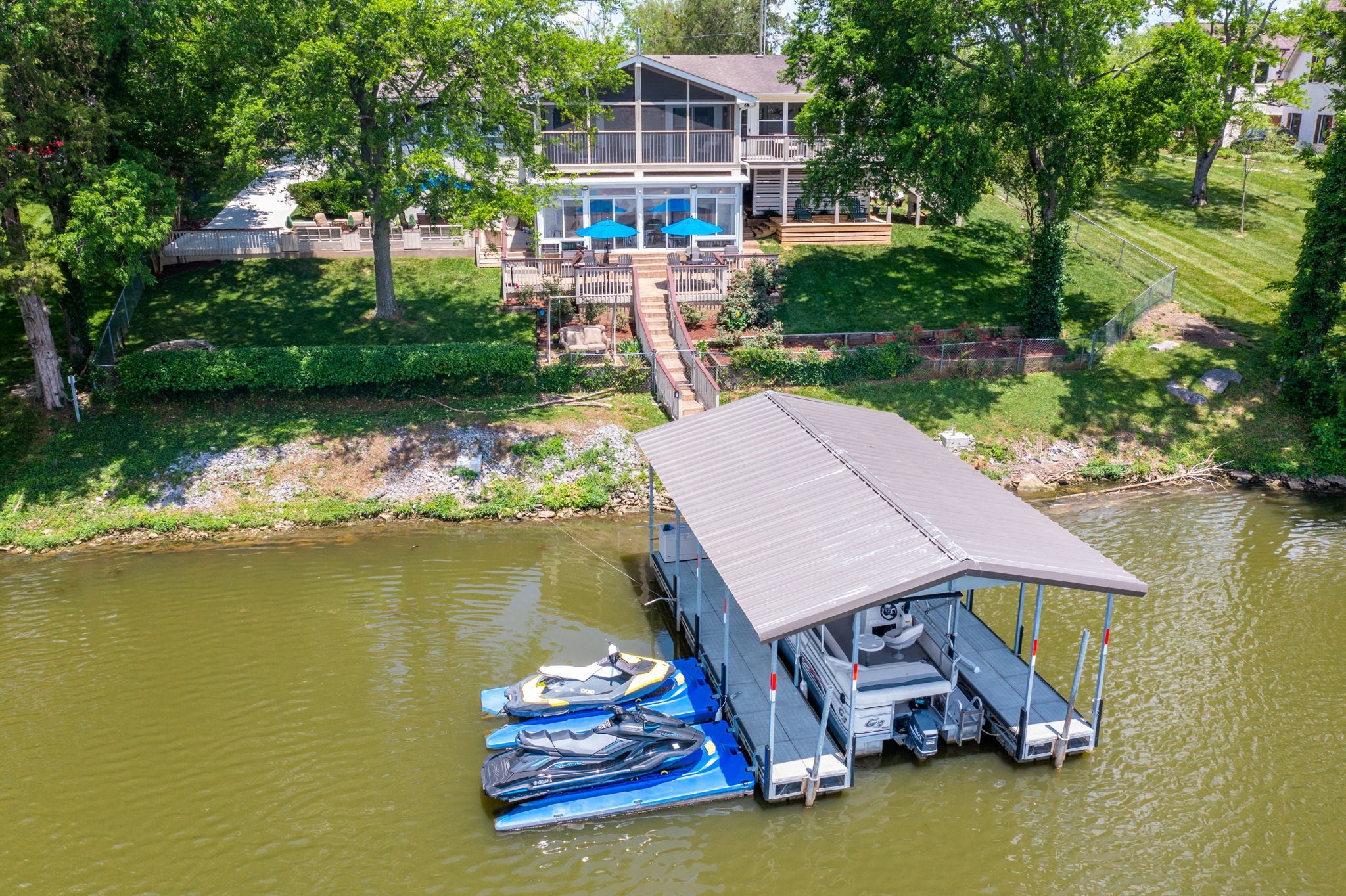 812 Burton Point Road Mount Juliet, TN 37122 - Photo 46 of 59 an aerial view of a house with swimming pool garden and lake view