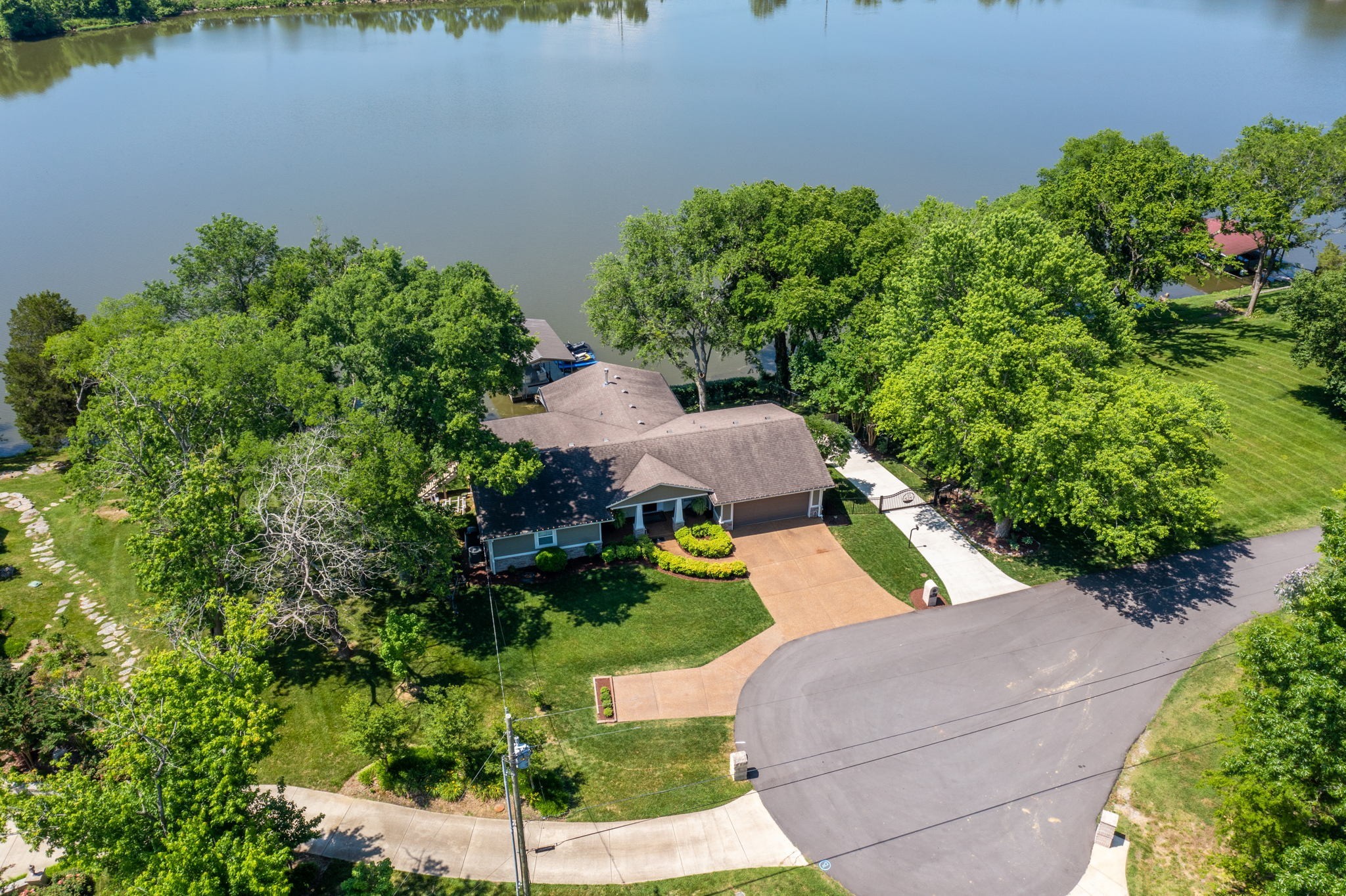 812 Burton Point Road Mount Juliet, TN 37122 - Photo 56 of 59 an aerial view of a house with a yard and lake view