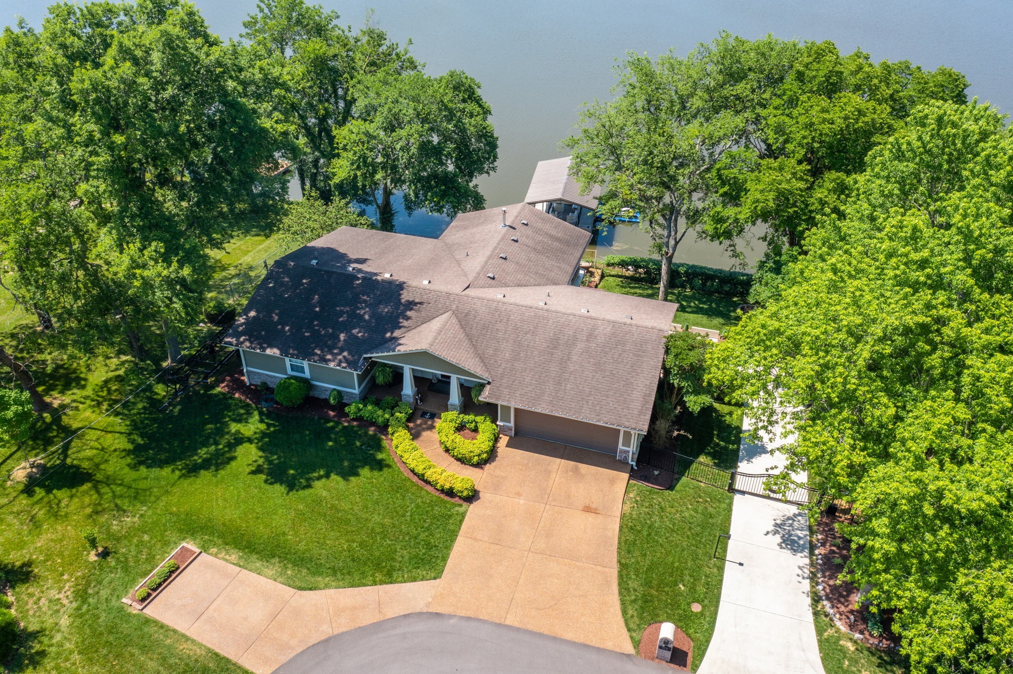 812 Burton Point Road Mount Juliet, TN 37122 - Photo 57 of 59 an aerial view of a house with a garden and swimming pool